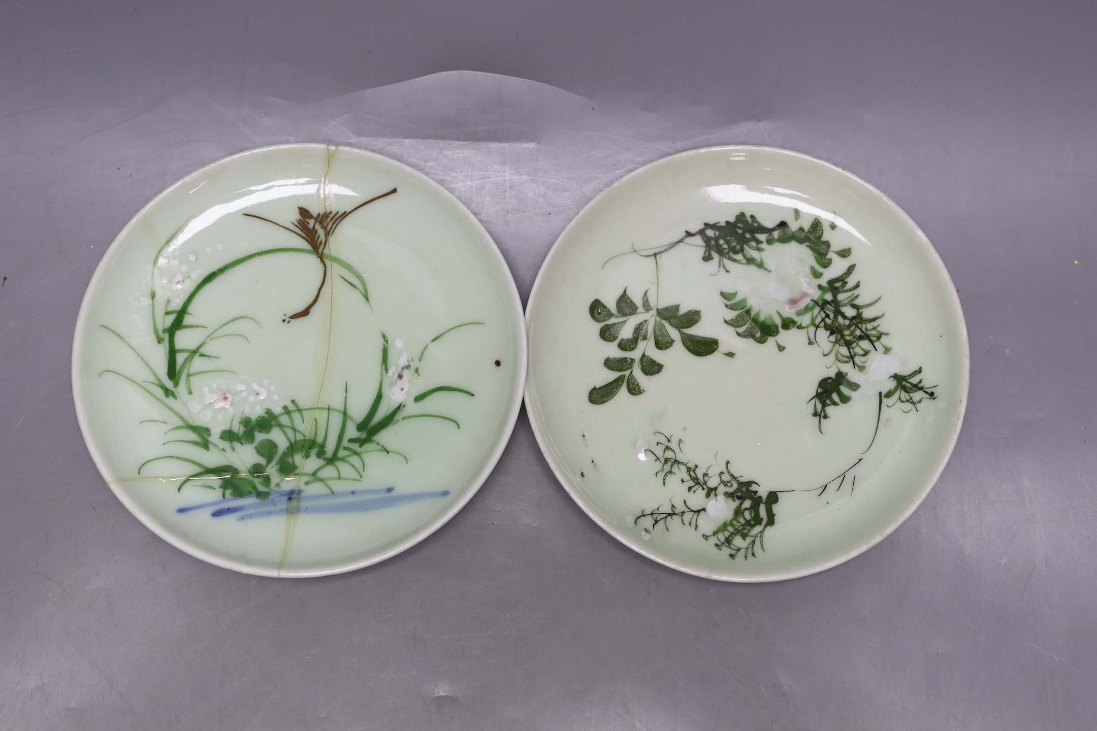 A pair of Japanese Nabesima style jars and covers and a similar footed dish, together with a Japanese Satsuma bowl, 11cm diameter and two plates (5)